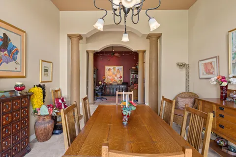 a living room with furniture a rug and a large window