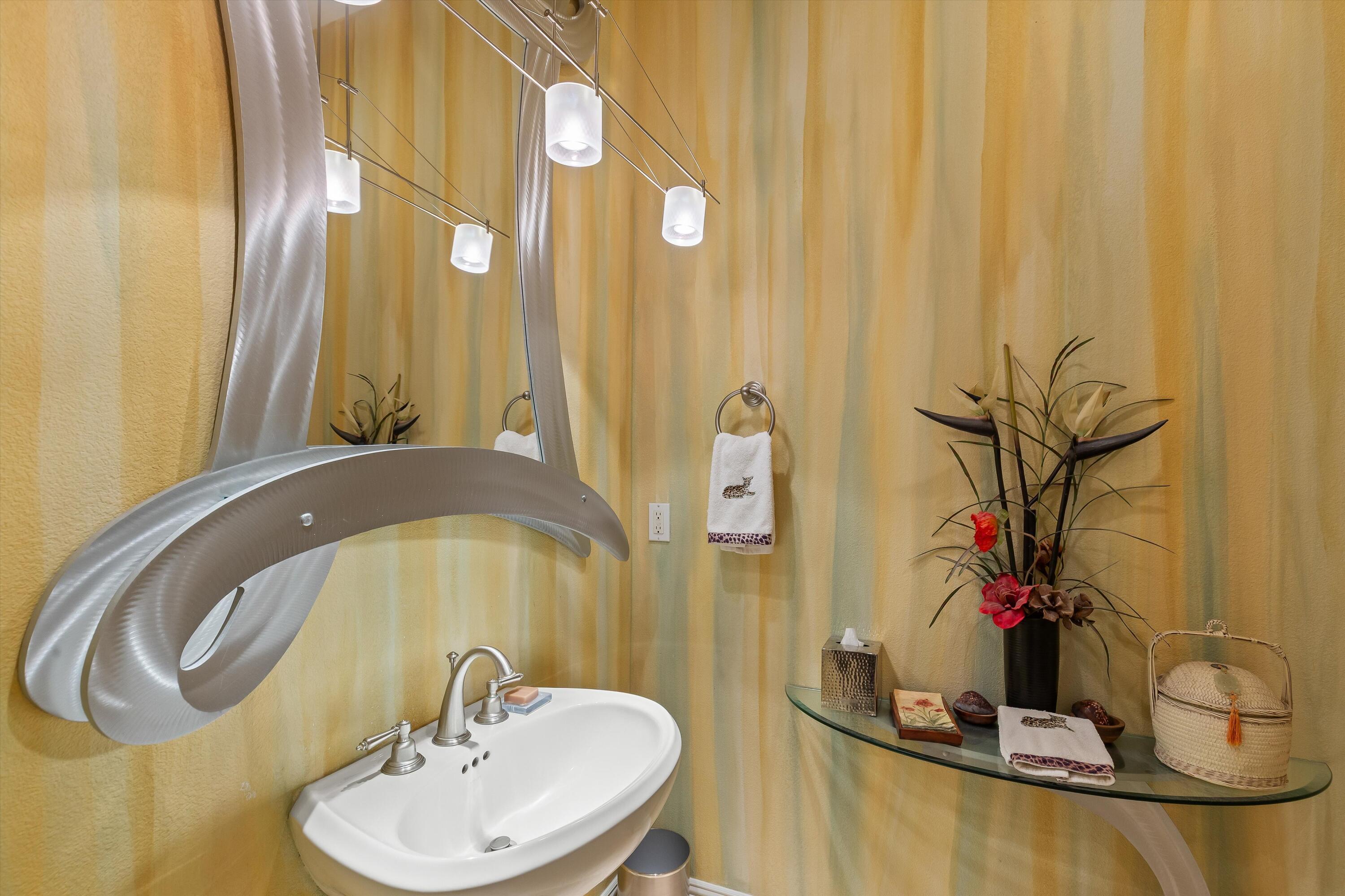 80460 Torreon Way La Quinta, CA 92253 - Photo 22 of 32 a bathroom with a sink and mirror with bathtub