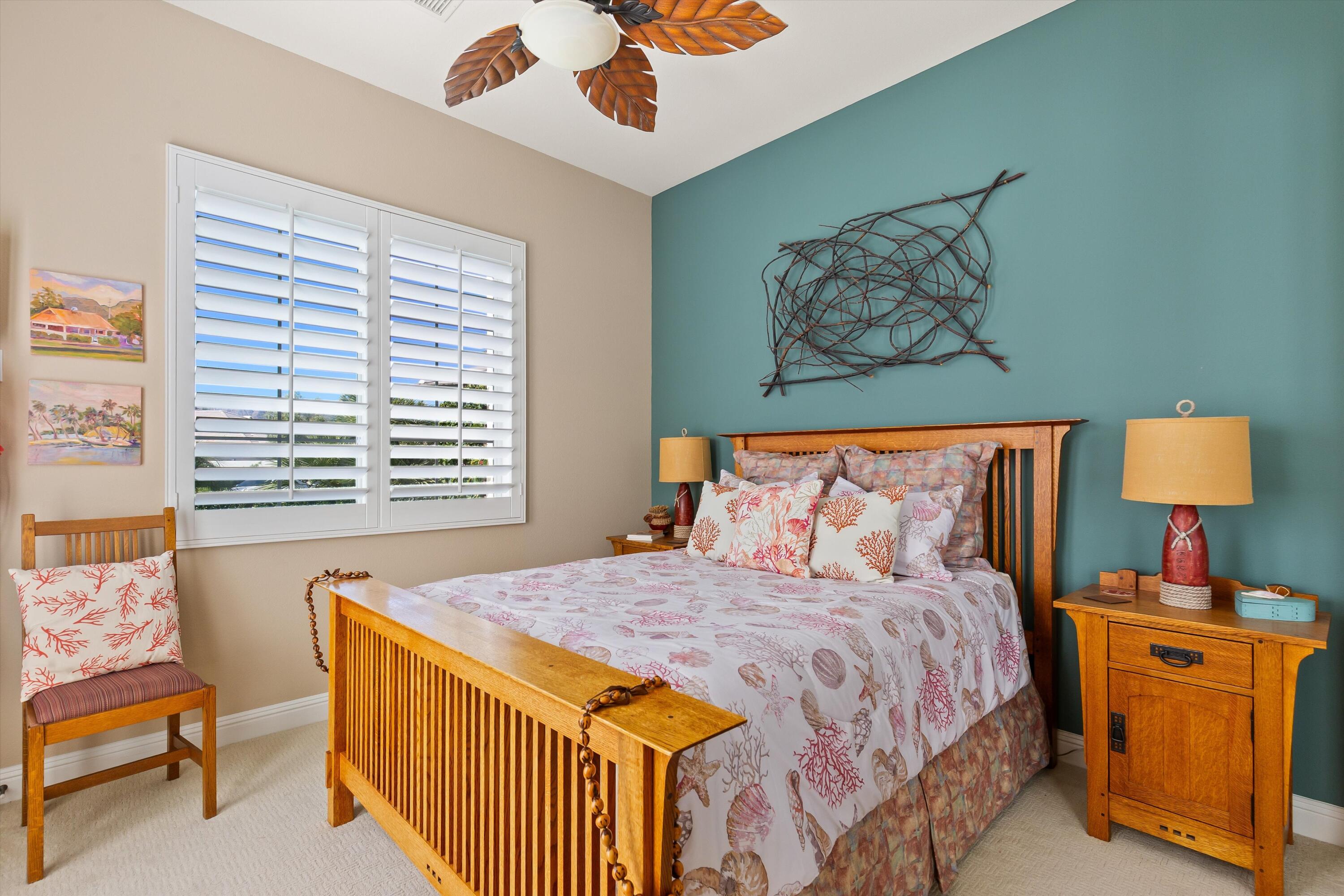 80460 Torreon Way La Quinta, CA 92253 - Photo 28 of 32 a bedroom with a bed and a lamp on dresser