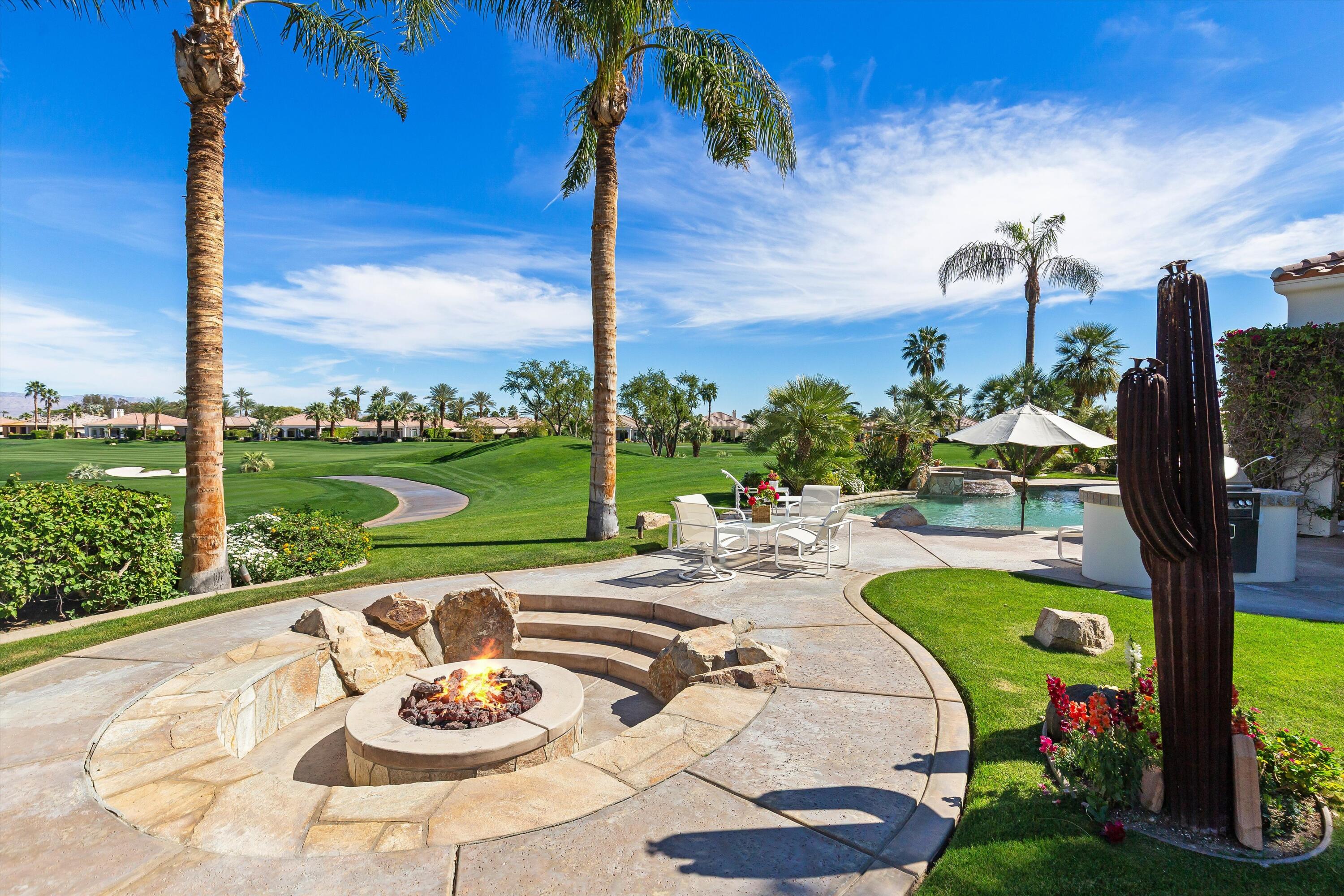 80460 Torreon Way La Quinta, CA 92253 - Photo 7 of 32 a view of a swimming pool with a patio