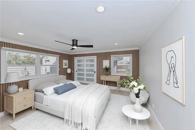 a bedroom with a bed and chandelier