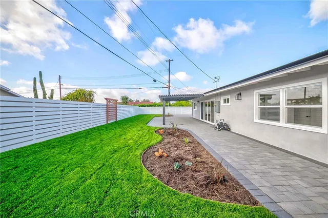 an aerial view of a house with a swimming pool