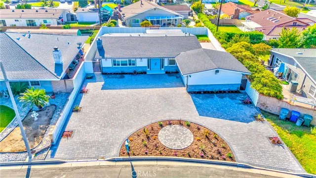 an aerial view of a house with a swimming pool
