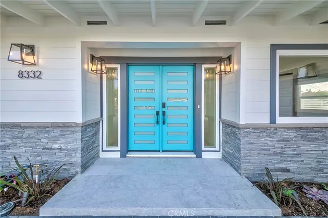 a view of front door of house with stairs