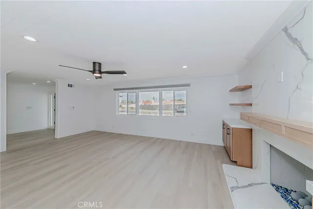 an empty room with windows and entrance