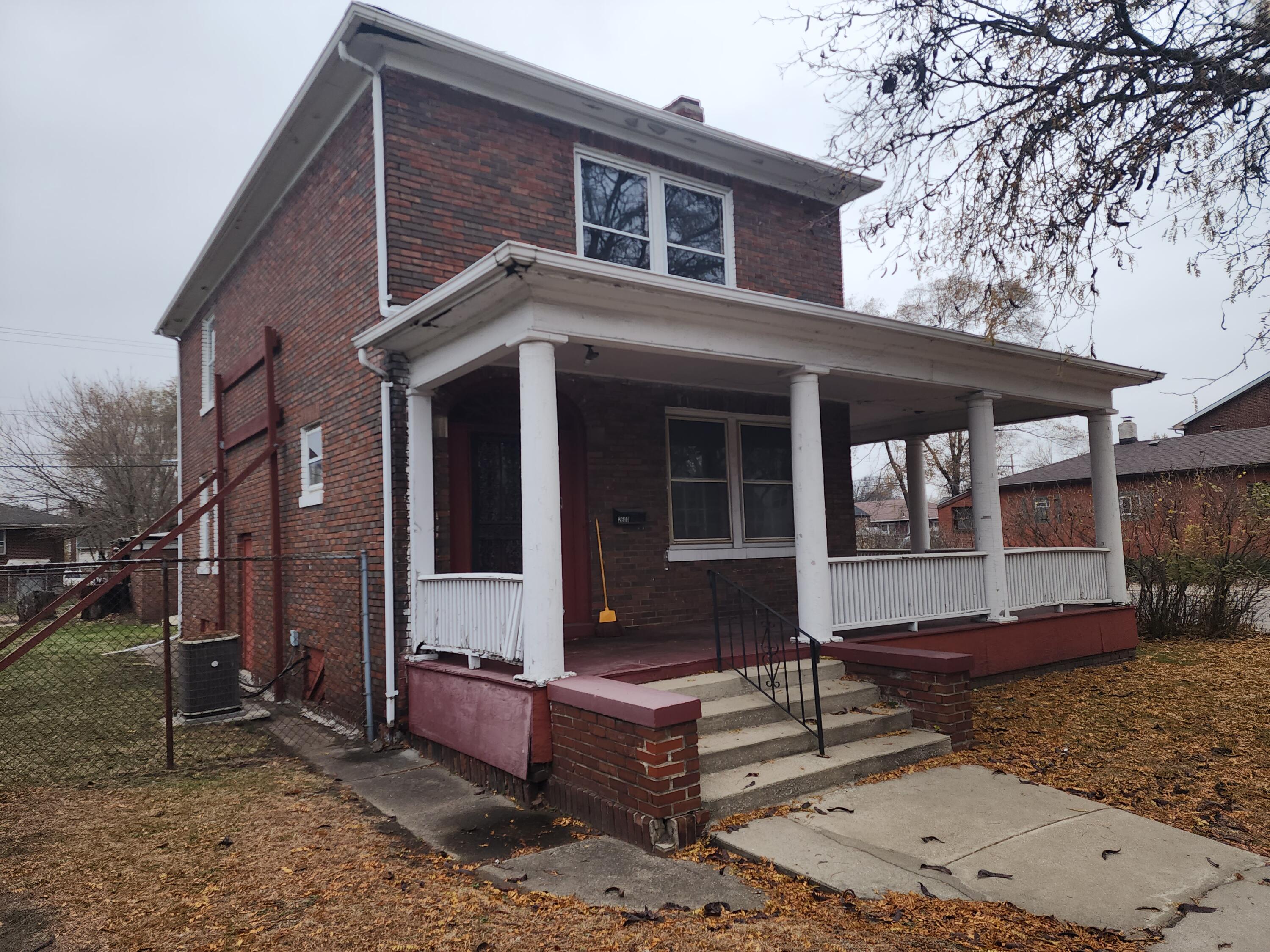 2600 Harrison Street Gary, IN 46407 - Photo 1 of 17 a front view of a house with garden