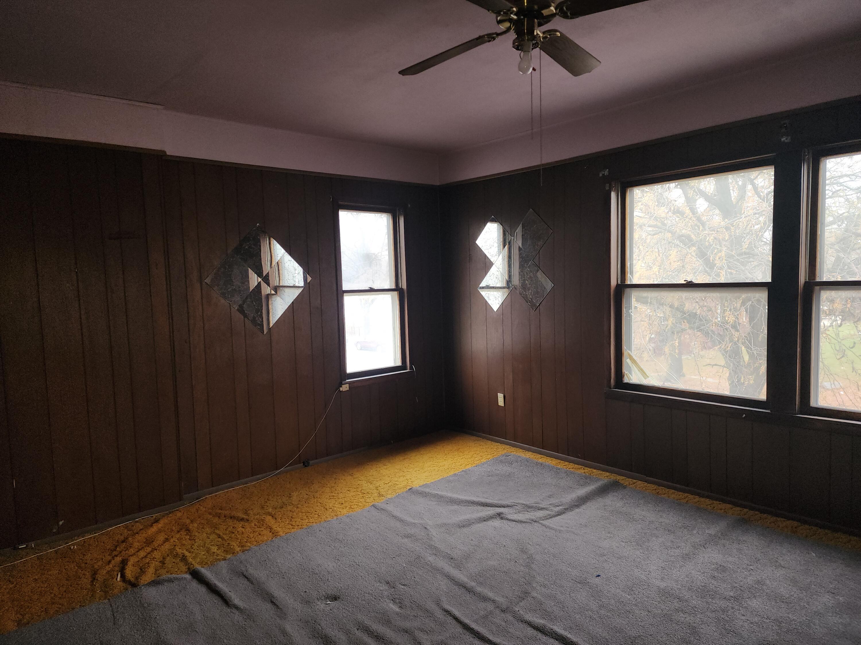 2600 Harrison Street Gary, IN 46407 - Photo 11 of 17 an empty room with windows and fan