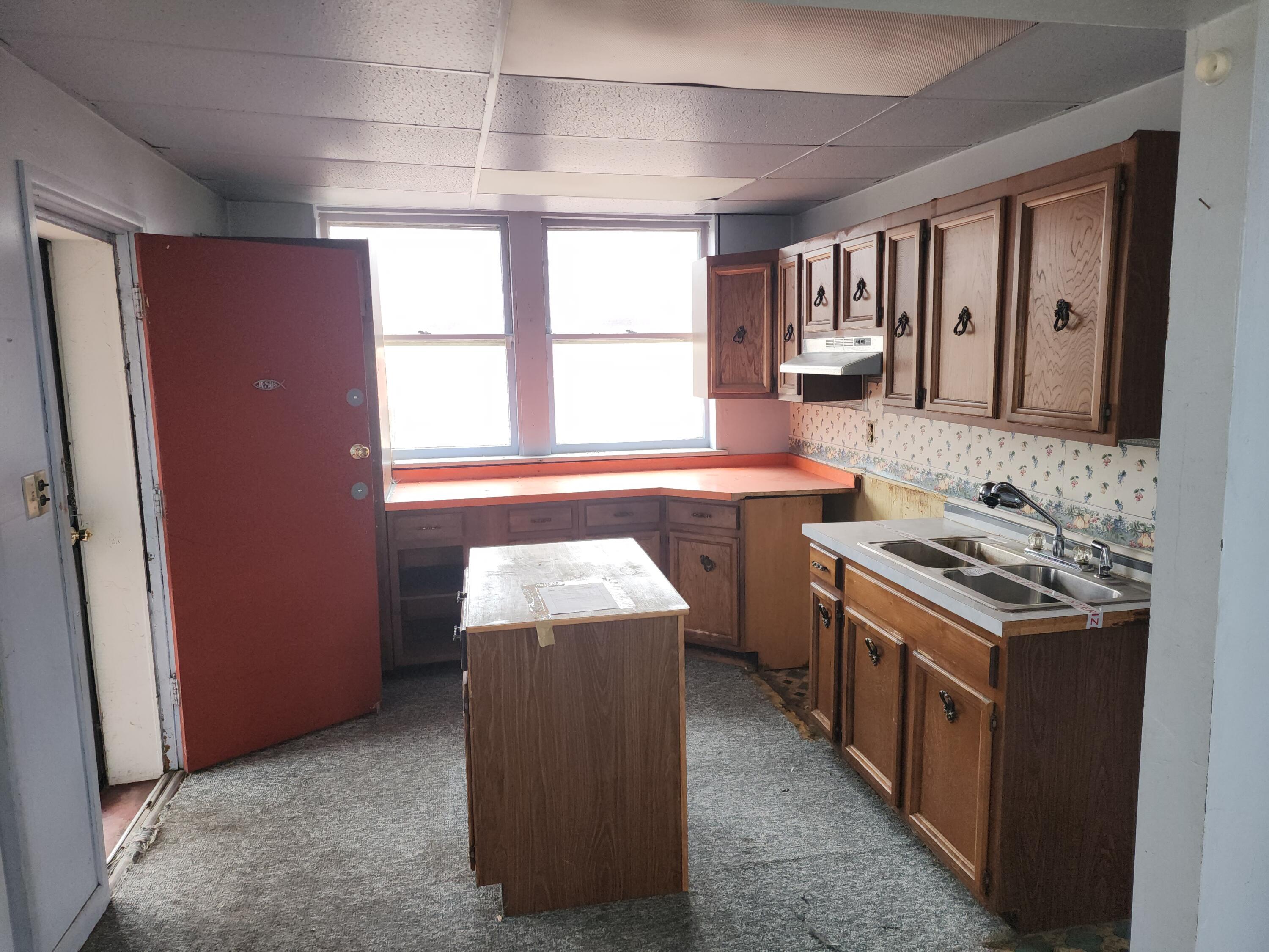 2600 Harrison Street Gary, IN 46407 - Photo 3 of 17 a kitchen with a stove and a sink