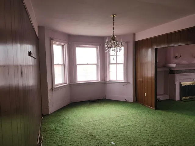 a view of room with window and entryway