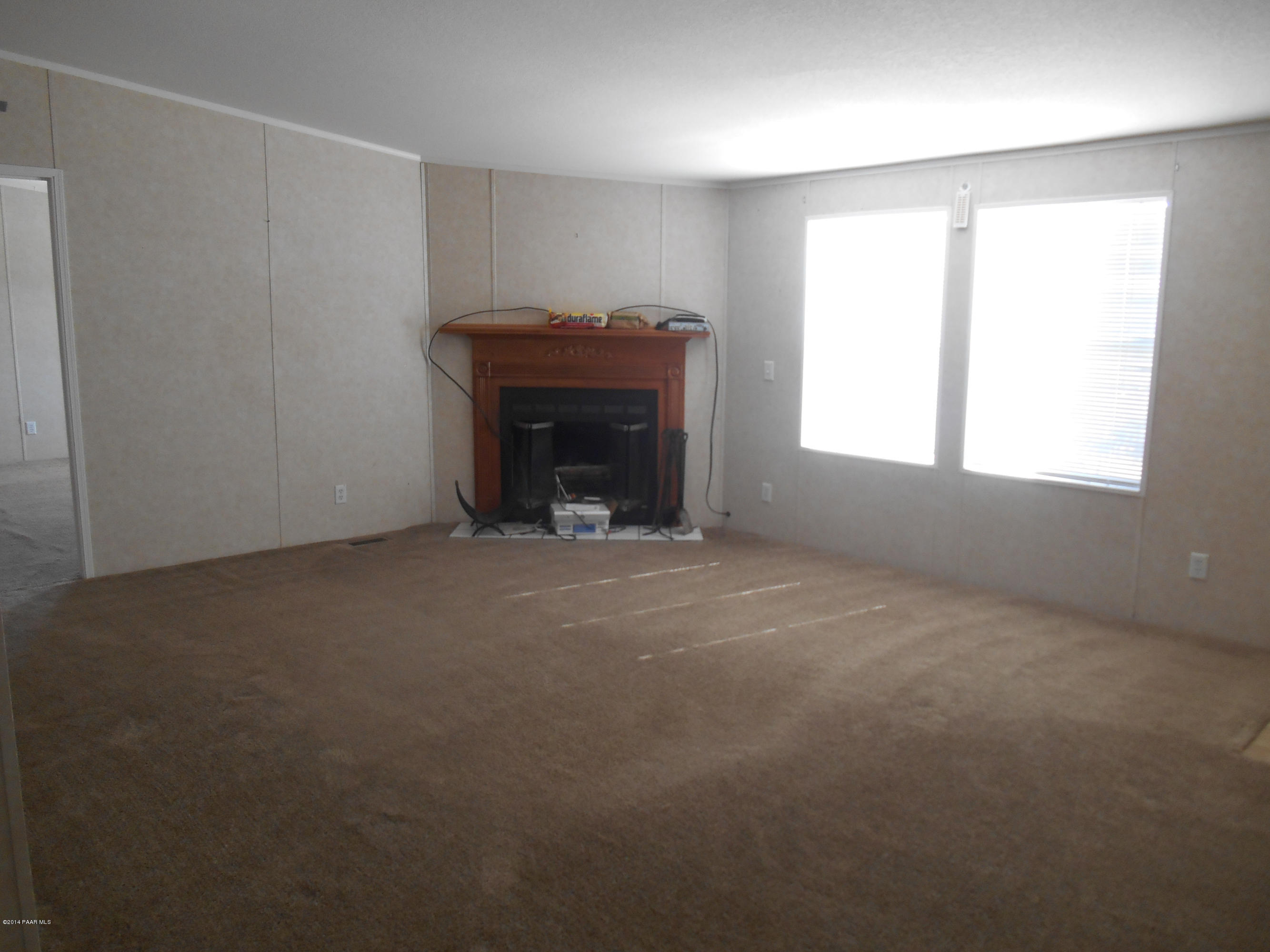 17120 Leprechaun Road Dewey, AZ 86327 - Photo 2 of 25 living room with fireplace