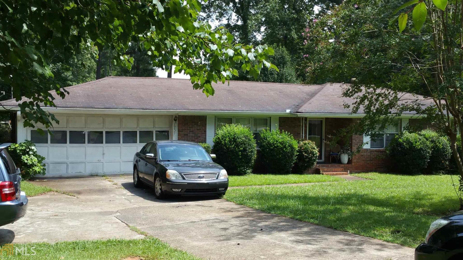 1237 Roscoe Road Newnan, GA 30263 - Photo 1 of 1 a house view with a garden space