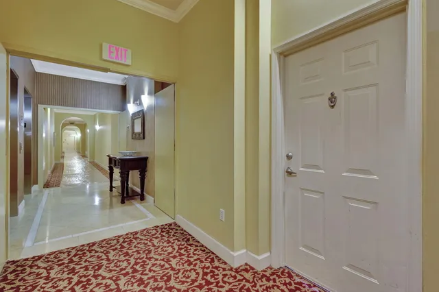 a view of a hallway with a furniture and a livingroom
