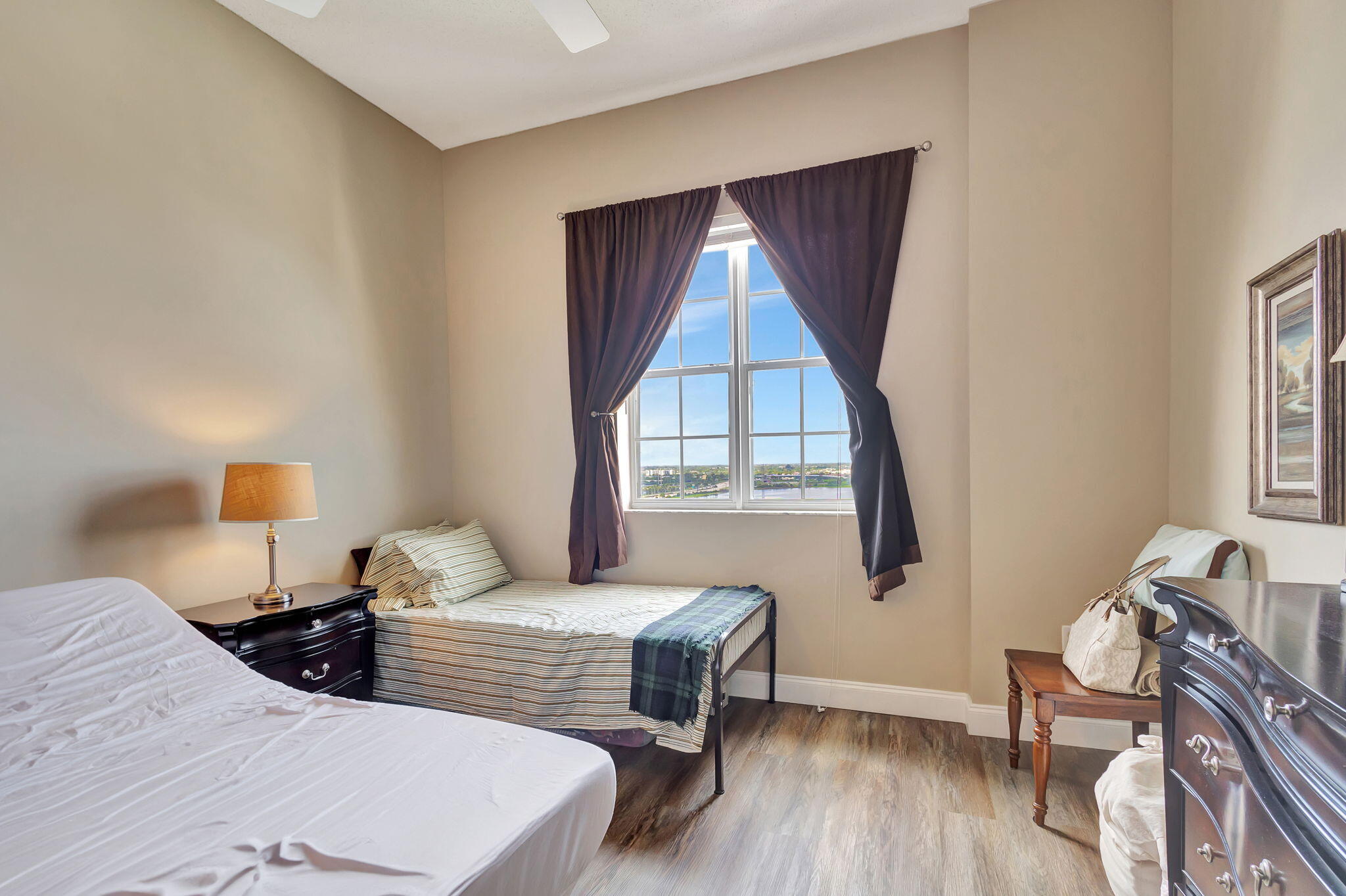 616 Clearwater Park Road, Unit LP06 West Palm Beach, FL 33401 - Photo 13 of 29 a bedroom with two beds and a window