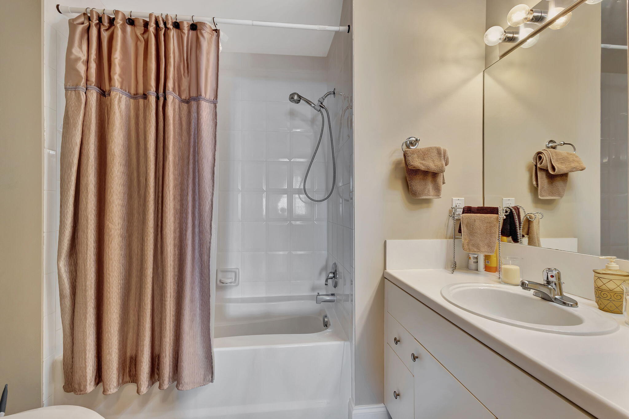 616 Clearwater Park Road, Unit LP06 West Palm Beach, FL 33401 - Photo 19 of 29 a bathroom with a granite countertop sink and a mirror