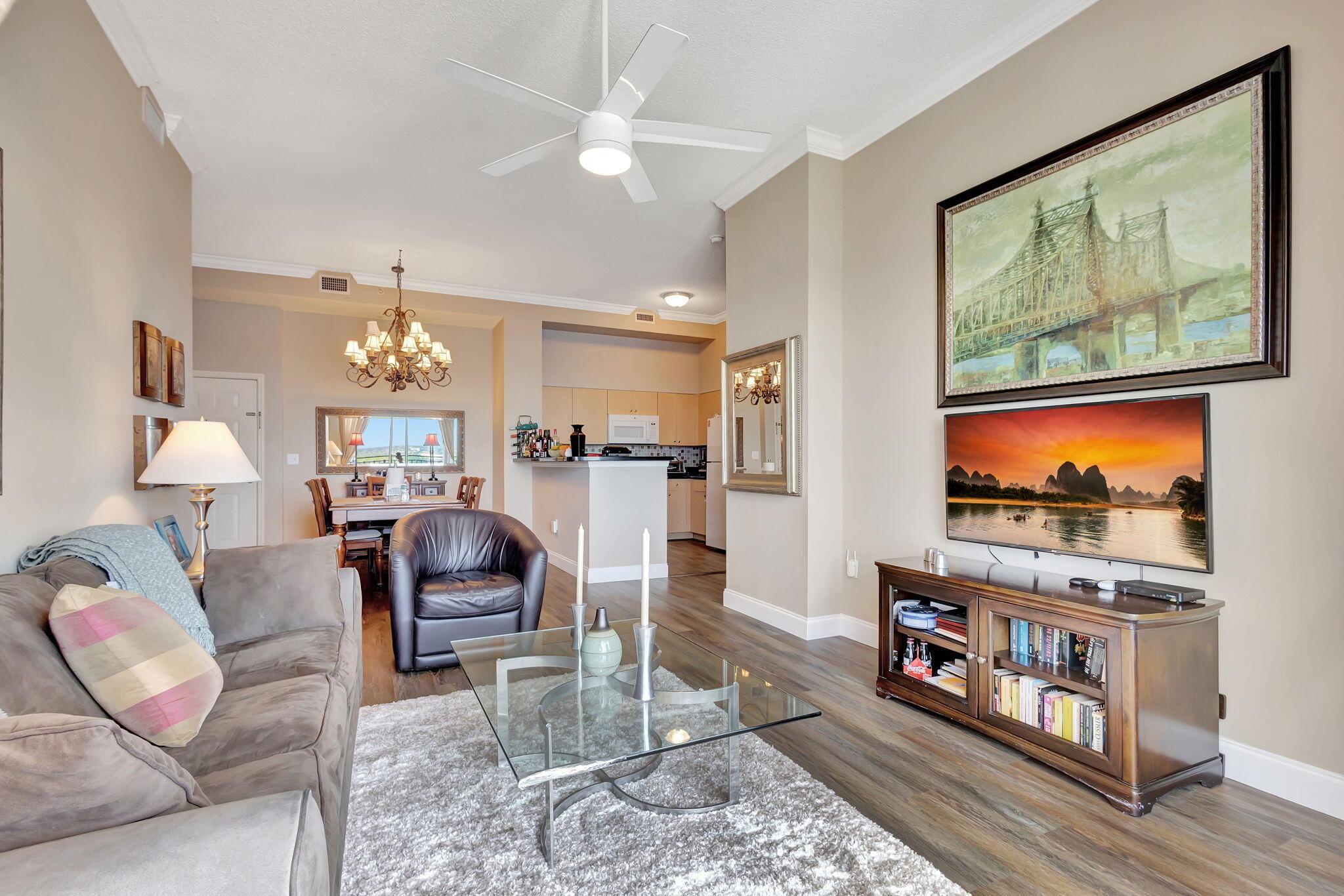 616 Clearwater Park Road, Unit LP06 West Palm Beach, FL 33401 - Photo 8 of 29 a living room with furniture and a flat screen tv
