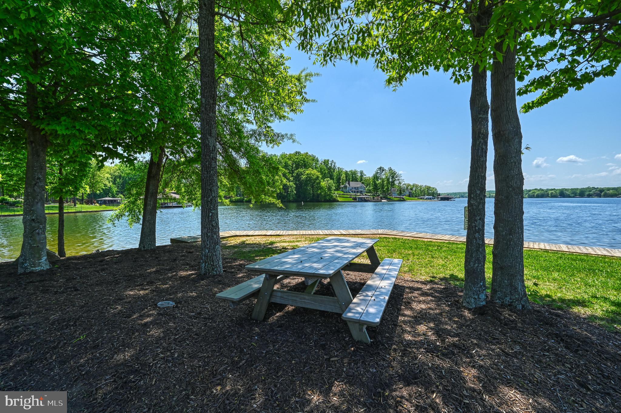92 Mill Run Bumpass, VA 23024 - Photo 1 of 12 a view of a lake with outdoor space