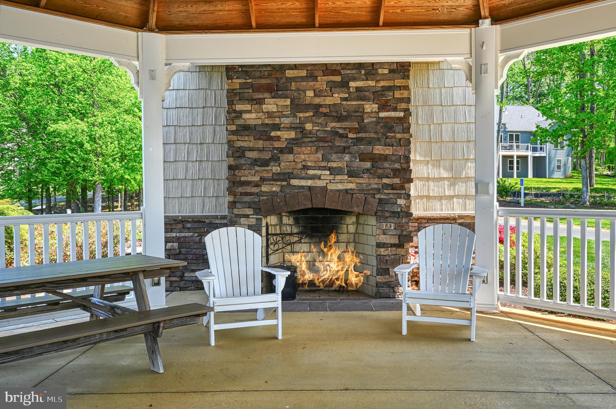 92 Mill Run Bumpass, VA 23024 - Photo 12 of 12 a building outdoor space with patio furniture and potted plants