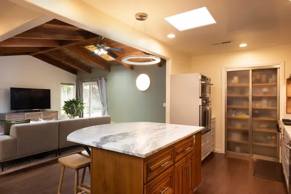 a kitchen with a table and chairs