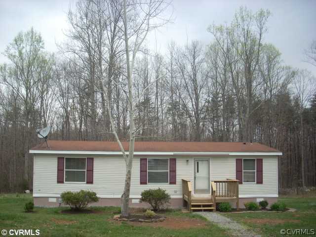 331 State Rte F 189 Louisa, VA 23093 - Photo 1 of 12 a front view of a house with garden and trees