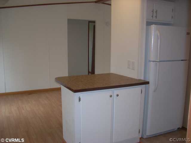 331 State Rte F 189 Louisa, VA 23093 - Photo 5 of 12 a kitchen with a refrigerator and wooden floor
