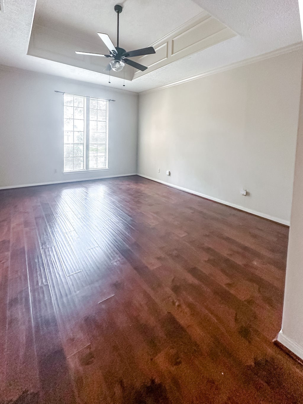 18319 Arbor Terrace Drive Spring, TX 77388 - Photo 10 of 34 an empty room with wooden floor ceiling fan and windows