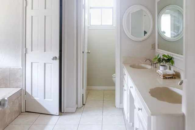 a bathroom with a bathtub and shower