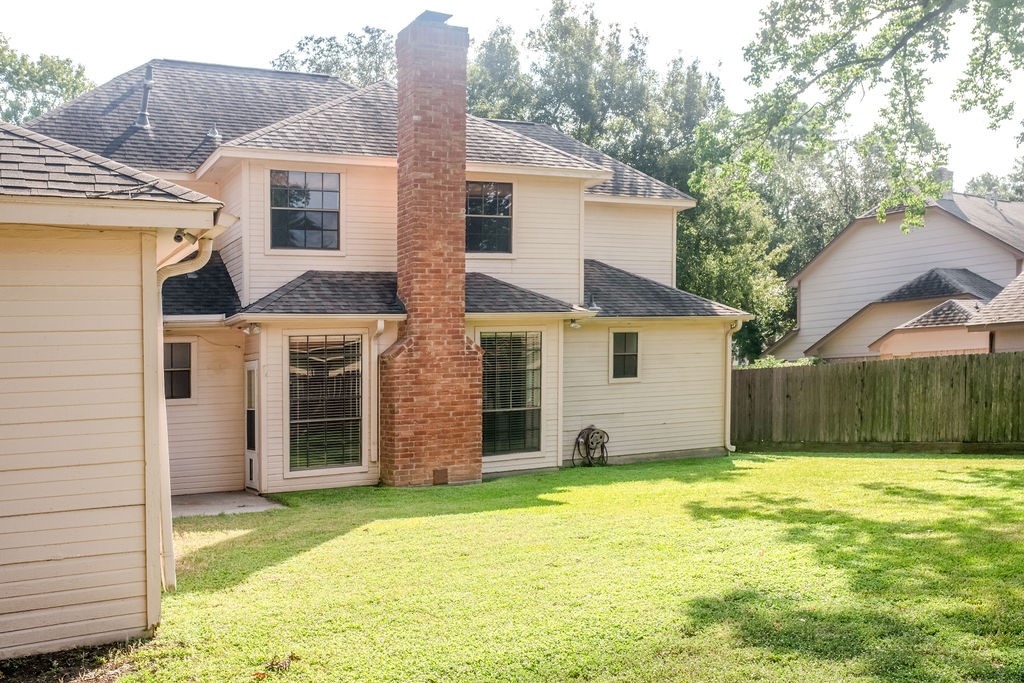 18319 Arbor Terrace Drive Spring, TX 77388 - Photo 16 of 34 a view of a house with a yard and garage