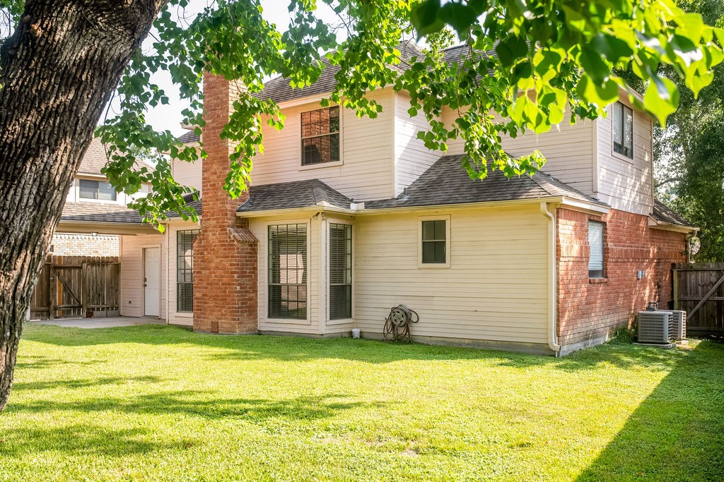 18319 Arbor Terrace Drive Spring, TX 77388 - Photo 17 of 34 a view of a house with a yard