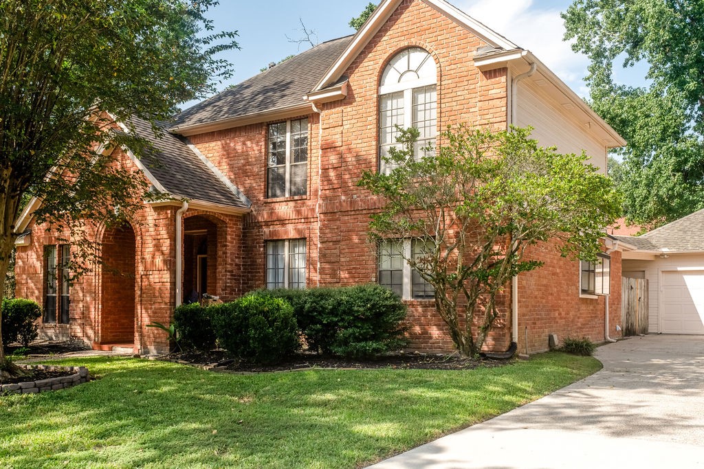 18319 Arbor Terrace Drive Spring, TX 77388 - Photo 2 of 34 a front view of a house with a yard