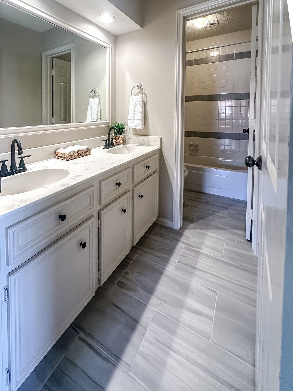 18319 Arbor Terrace Drive Spring, TX 77388 - Photo 24 of 34 a spacious bathroom with a double vanity sink and mirror
