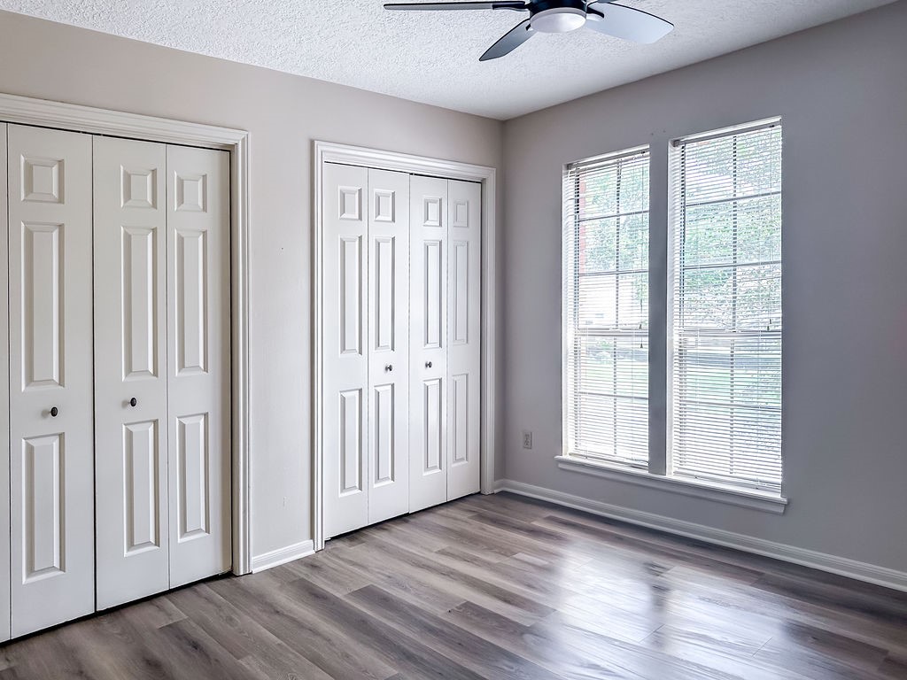 18319 Arbor Terrace Drive Spring, TX 77388 - Photo 27 of 34 a view of an empty room with a window and wooden floor