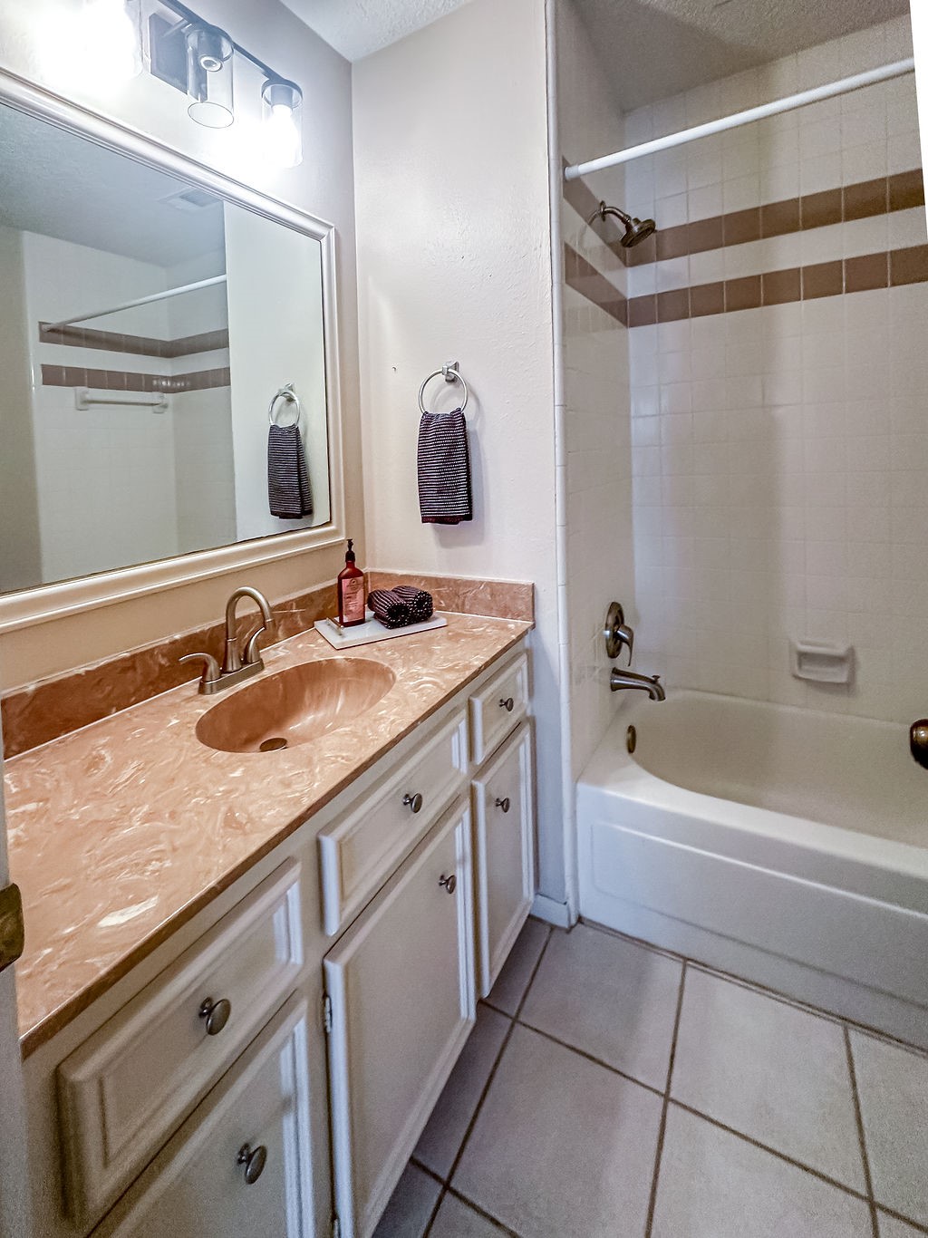 18319 Arbor Terrace Drive Spring, TX 77388 - Photo 28 of 34 a bathroom with a granite countertop sink a mirror a vanity and a bathtub