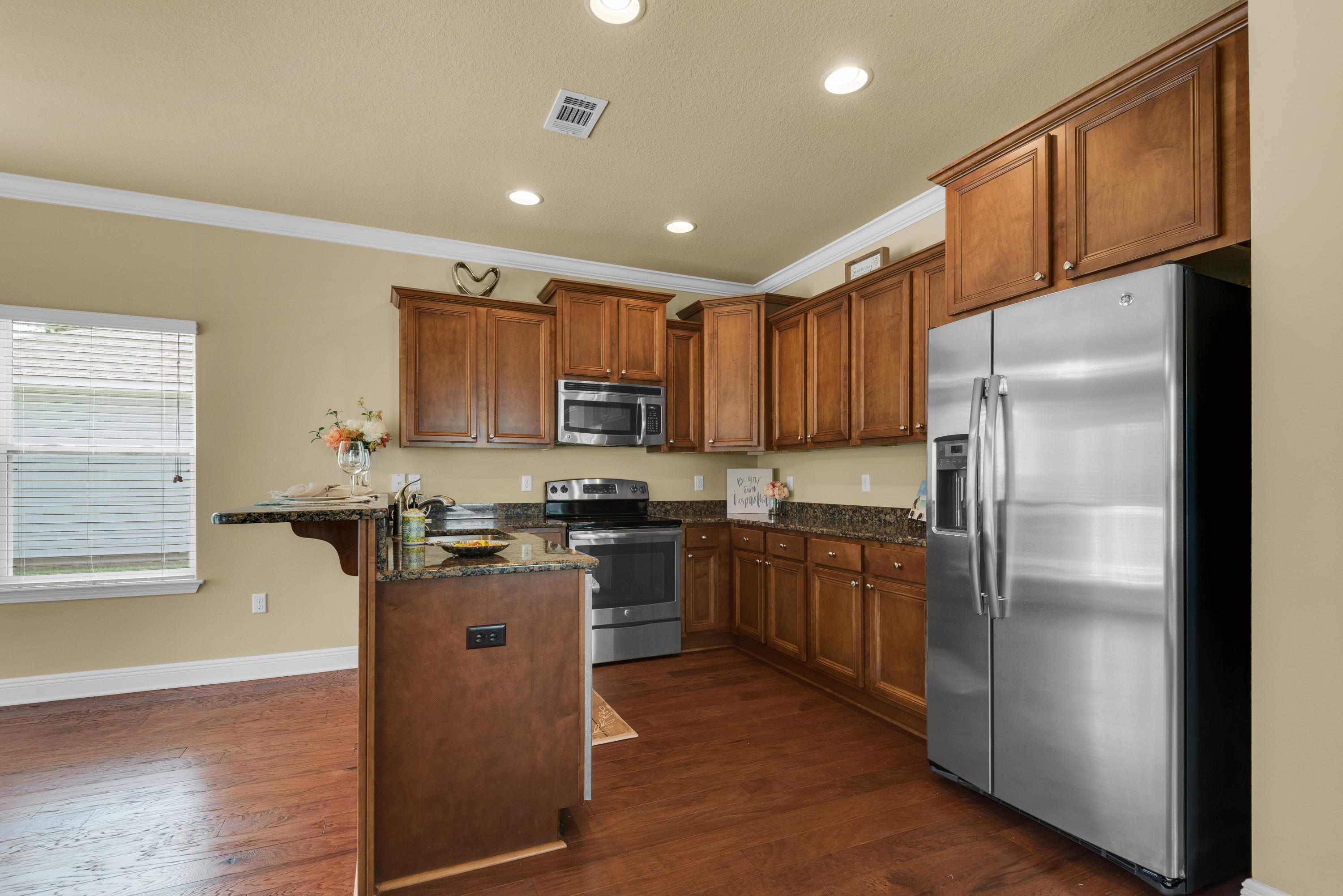 69 Topsail Drive Santa Rosa Beach, FL 32459 - Photo 34 of 34 a kitchen with granite countertop stainless steel appliances a refrigerator a stove top oven and a refrigerator