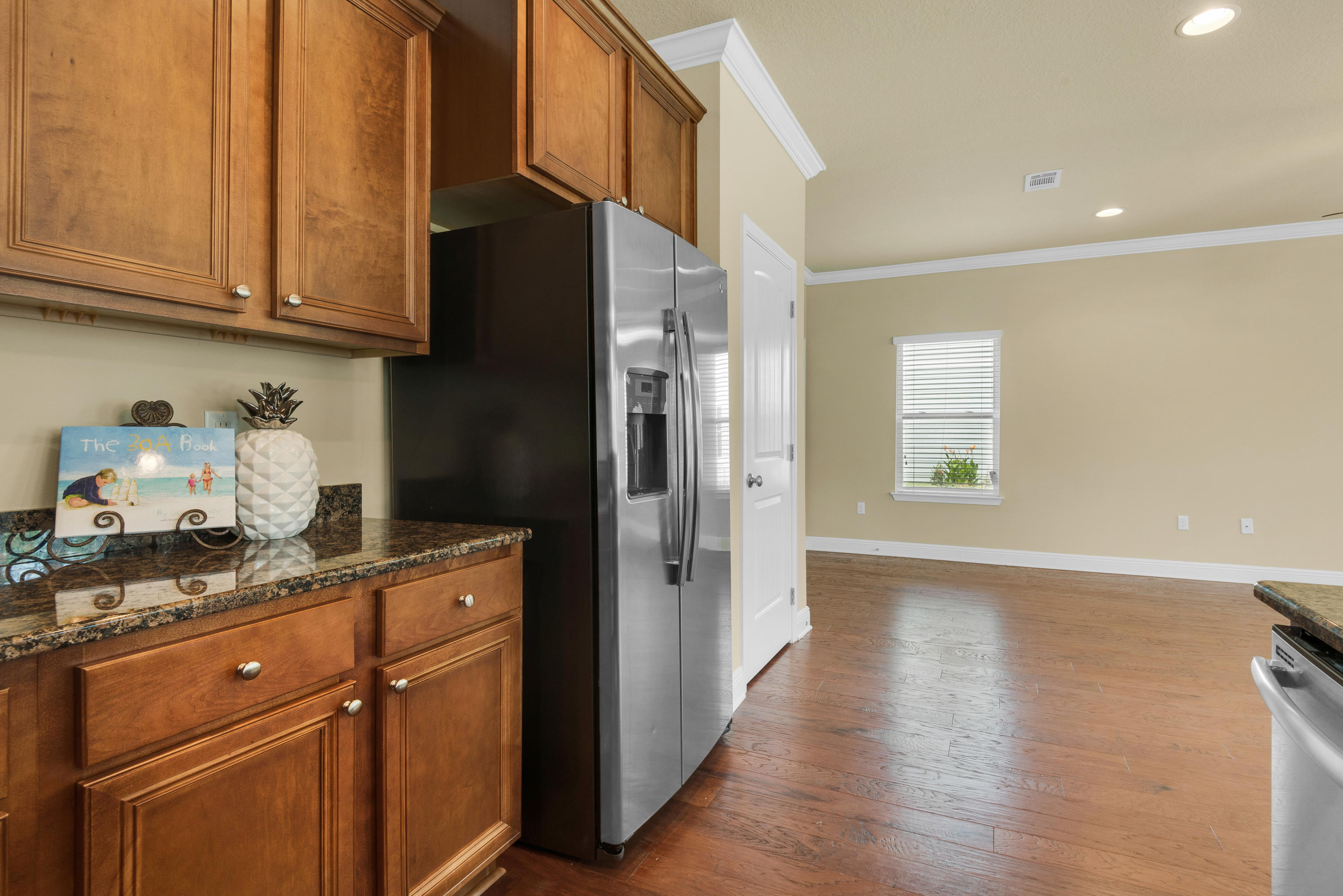 69 Topsail Drive Santa Rosa Beach, FL 32459 - Photo 13 of 34 a kitchen with stainless steel appliances granite countertop a refrigerator and a stove top oven