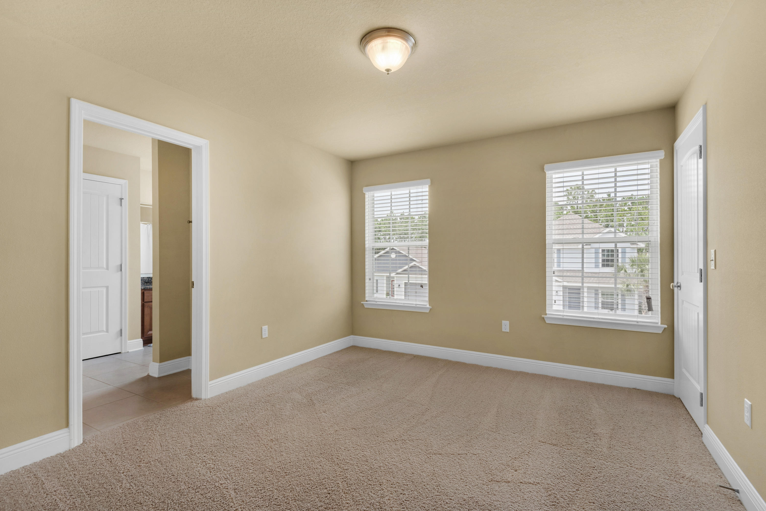 69 Topsail Drive Santa Rosa Beach, FL 32459 - Photo 20 of 34 an empty room with windows and closet