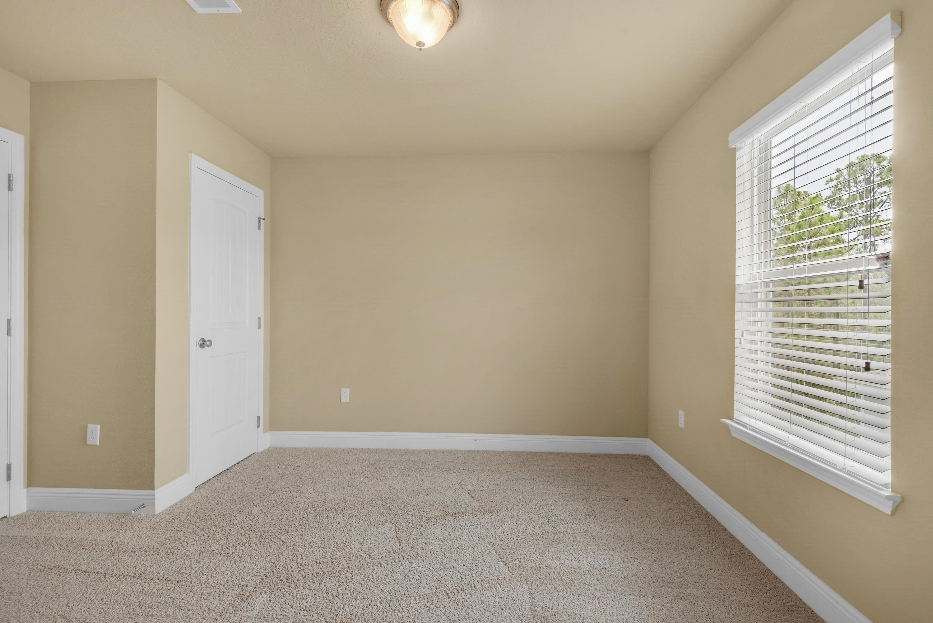 69 Topsail Drive Santa Rosa Beach, FL 32459 - Photo 22 of 34 a view of an empty room with a window