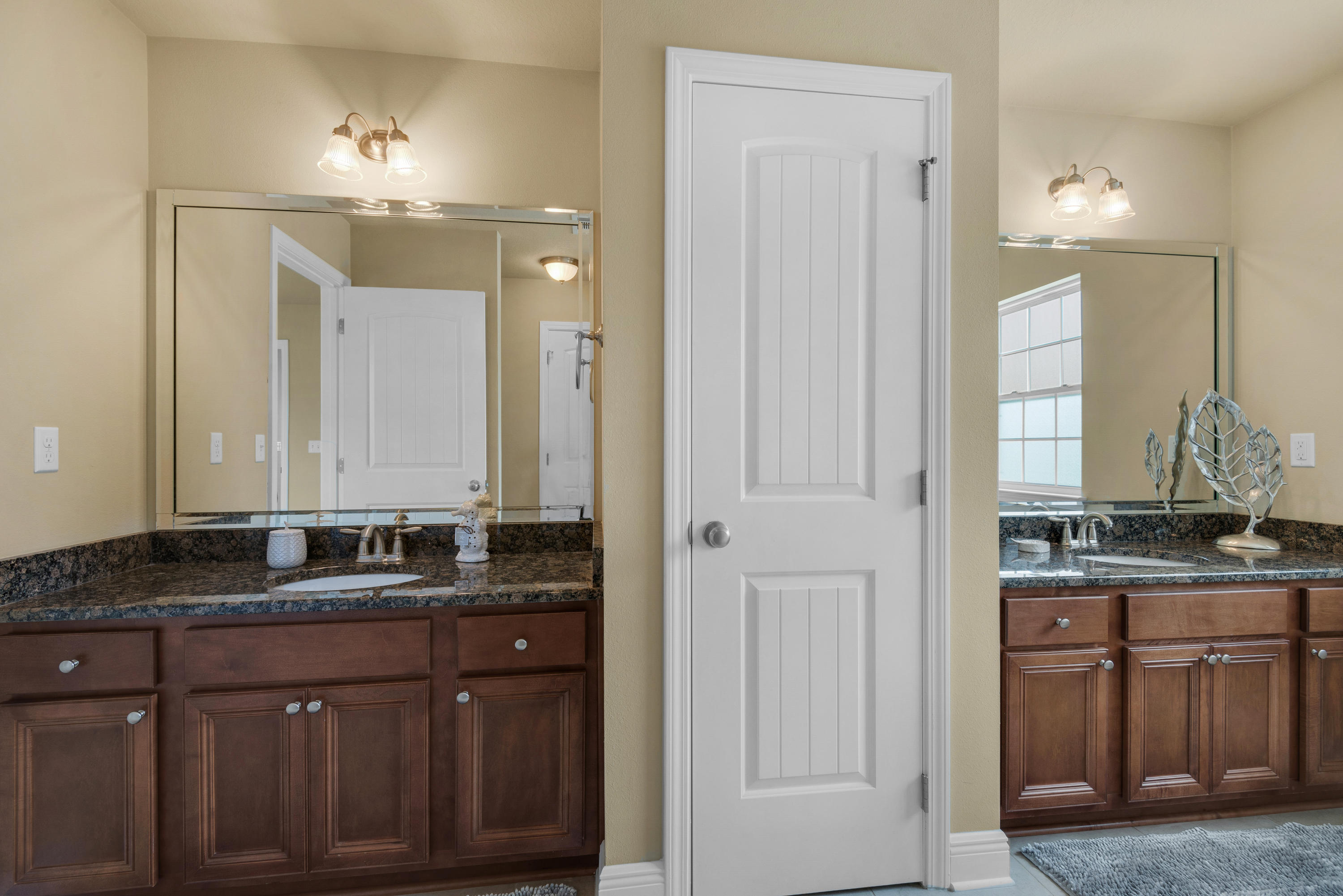 69 Topsail Drive Santa Rosa Beach, FL 32459 - Photo 24 of 34 a bathroom with double sink and a mirror