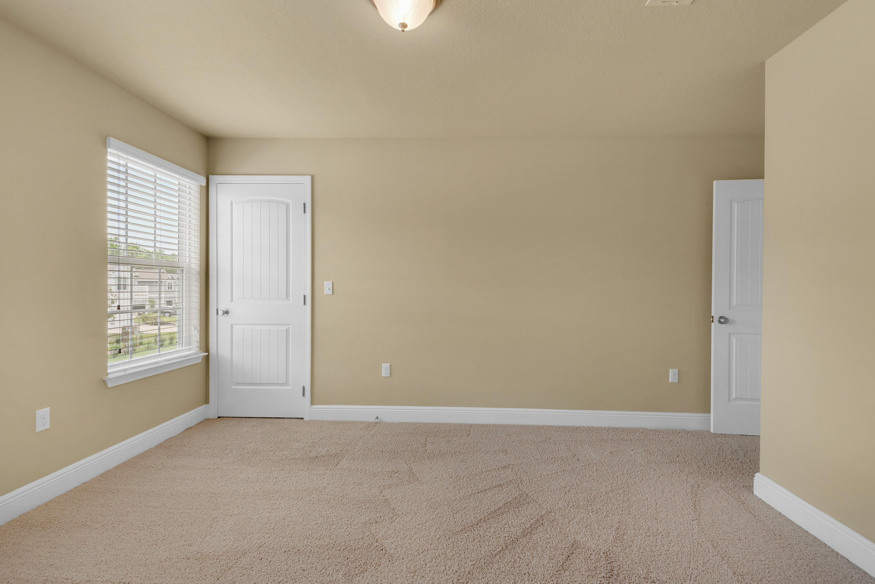 69 Topsail Drive Santa Rosa Beach, FL 32459 - Photo 25 of 34 an empty room with windows and closet