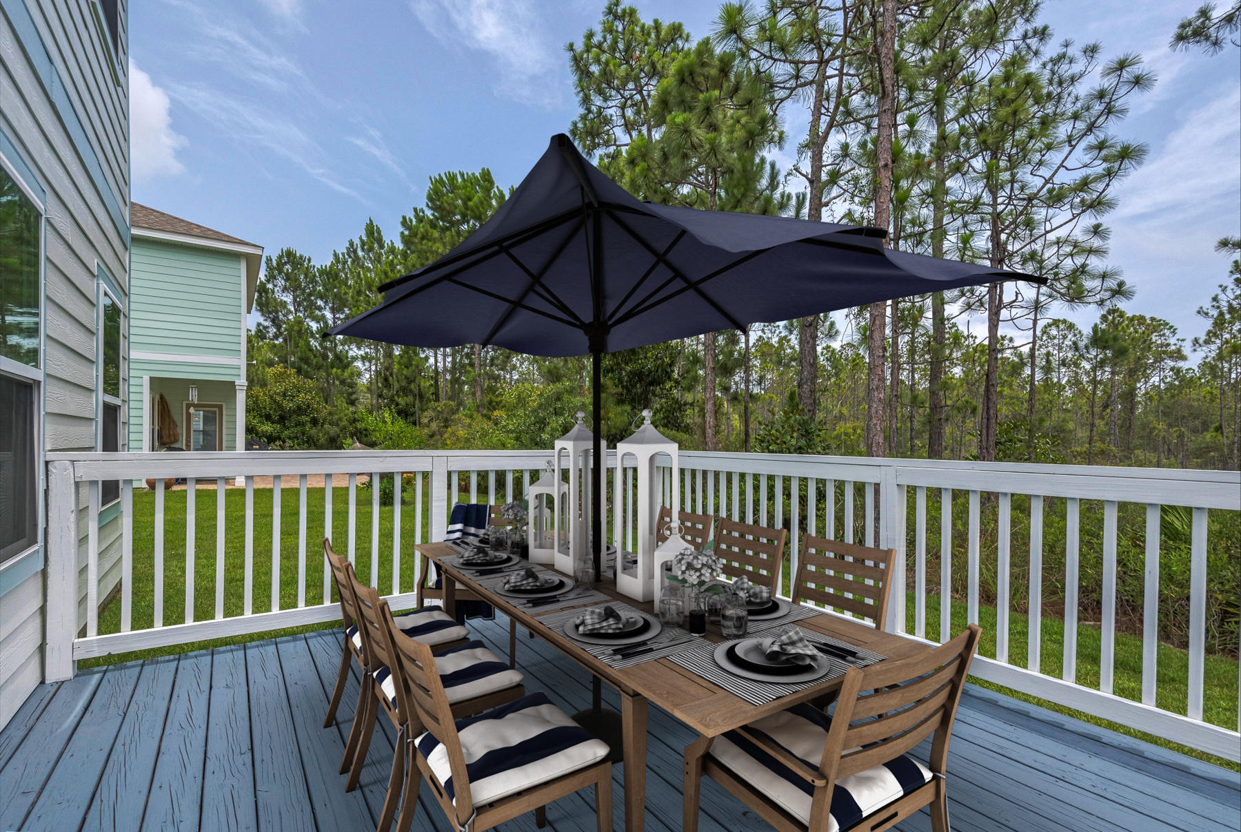 69 Topsail Drive Santa Rosa Beach, FL 32459 - Photo 29 of 34 a view of a wooden deck with furniture