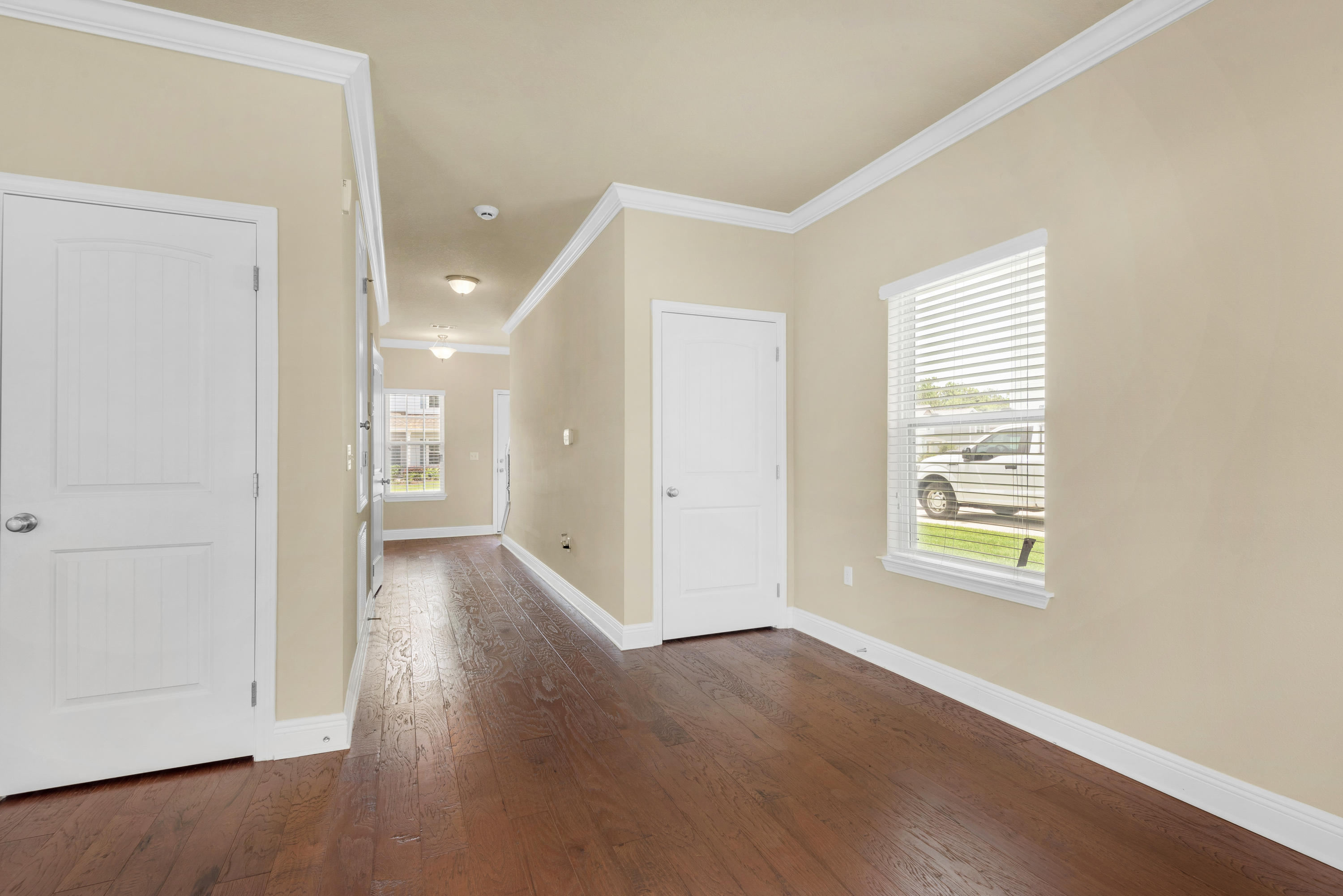 69 Topsail Drive Santa Rosa Beach, FL 32459 - Photo 4 of 34 a view of a room with wooden floor and window