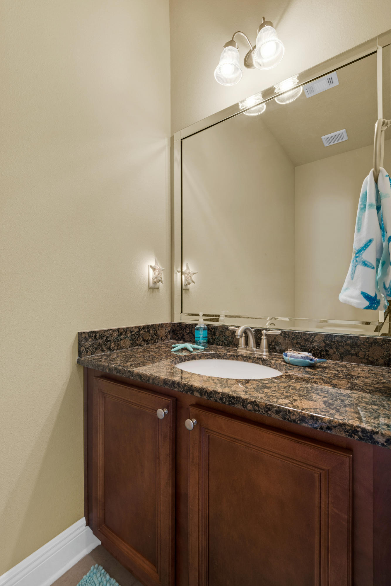 69 Topsail Drive Santa Rosa Beach, FL 32459 - Photo 6 of 34 a bathroom with a granite countertop sink and a mirror