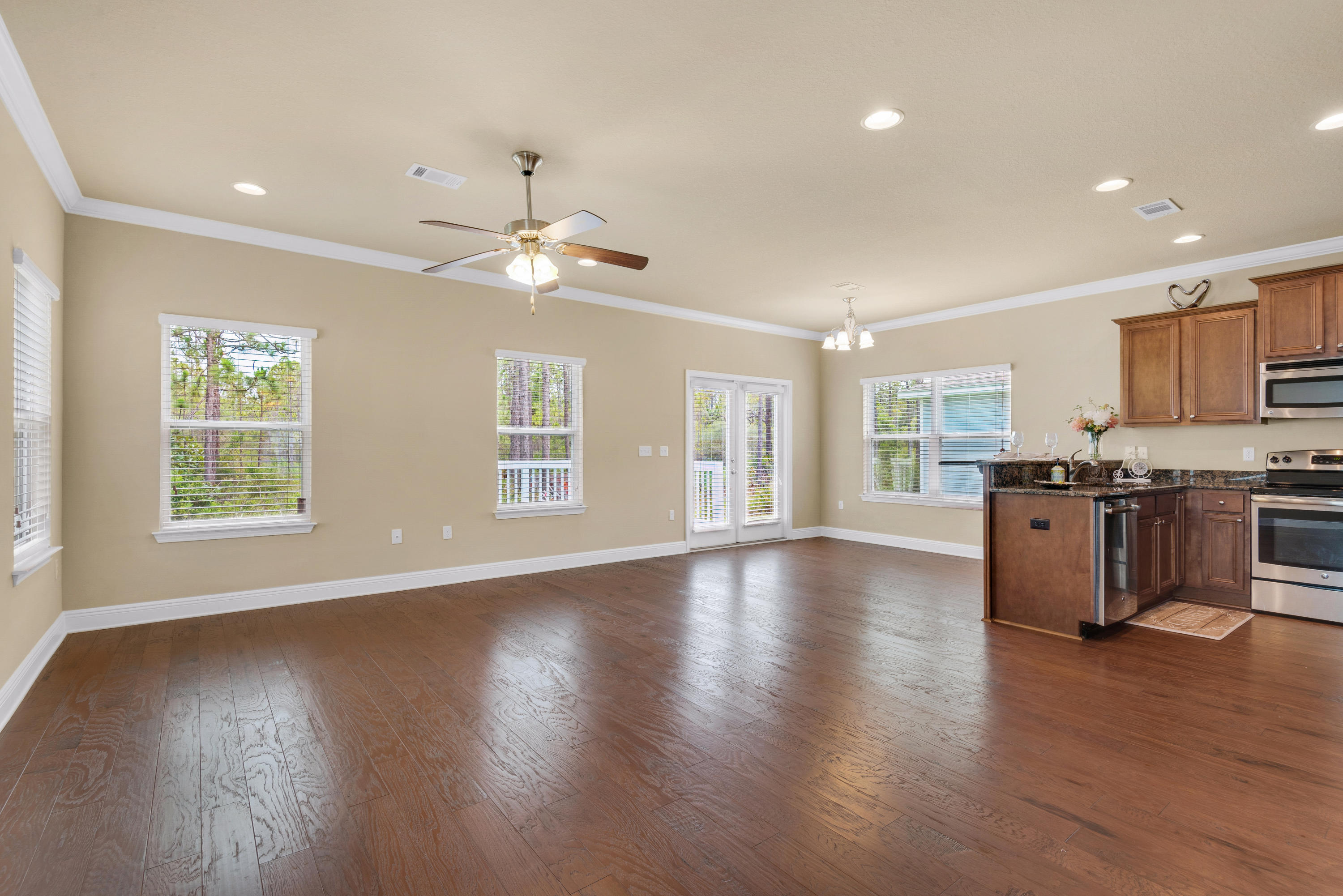 69 Topsail Drive Santa Rosa Beach, FL 32459 - Photo 8 of 34 a view of kitchen with stove and wooden floor