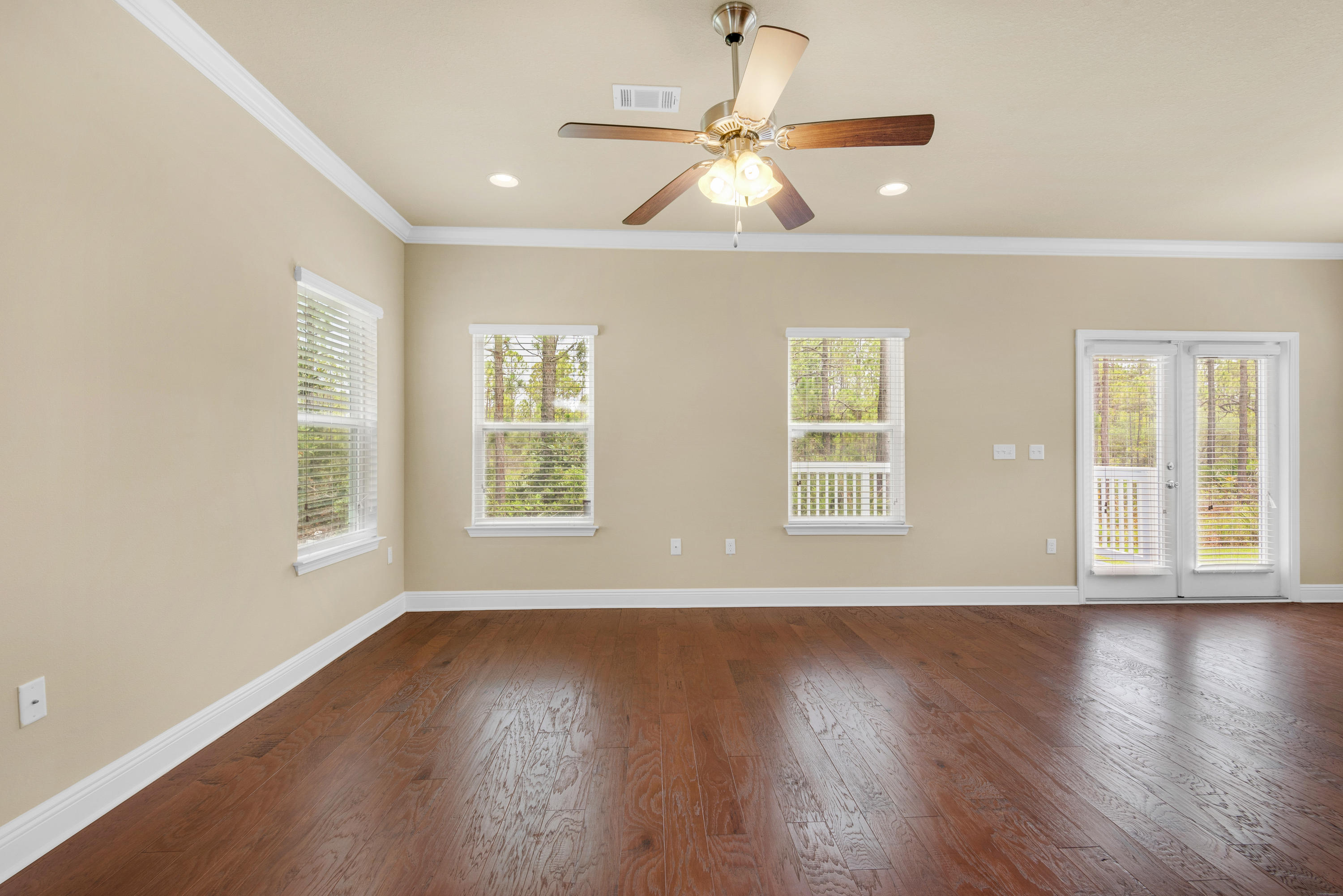 69 Topsail Drive Santa Rosa Beach, FL 32459 - Photo 9 of 34 a view of an empty room with wooden floor and a window