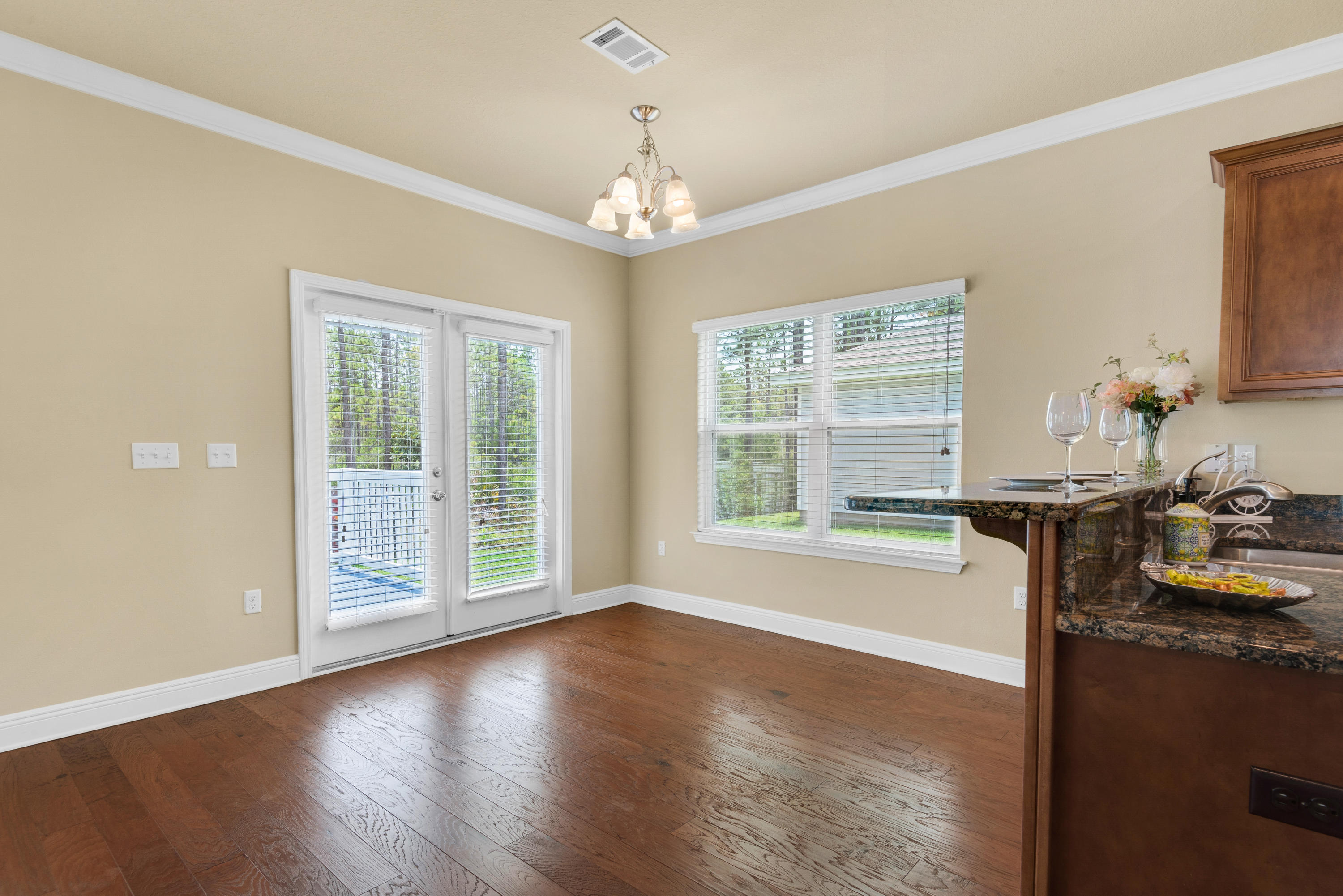 69 Topsail Drive Santa Rosa Beach, FL 32459 - Photo 10 of 34 a view of an empty room with wooden floor and a window