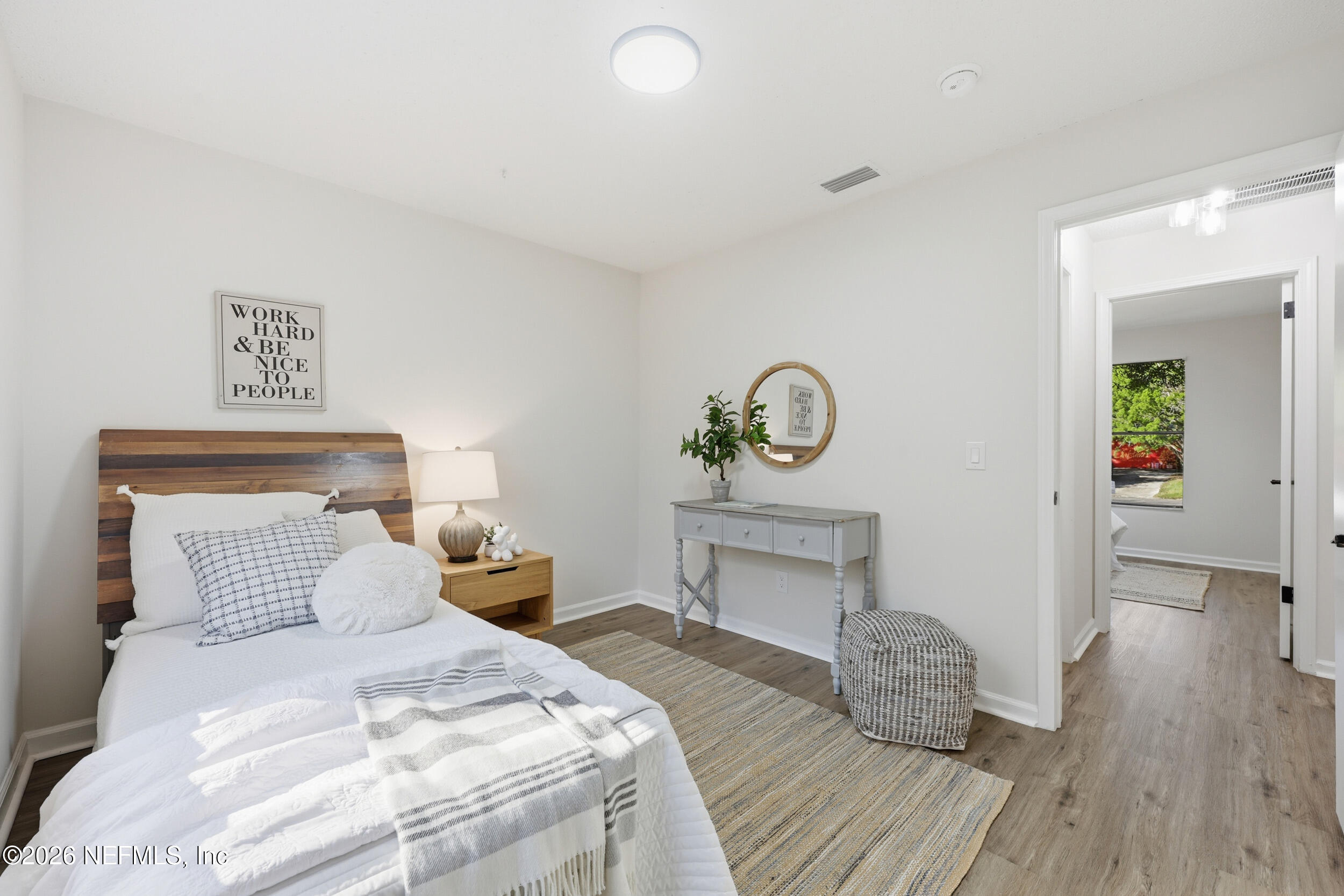 2171 Carter Braxton Road Orange Park, FL 32073 - Photo 11 of 39 a bedroom with a bed and wooden floor