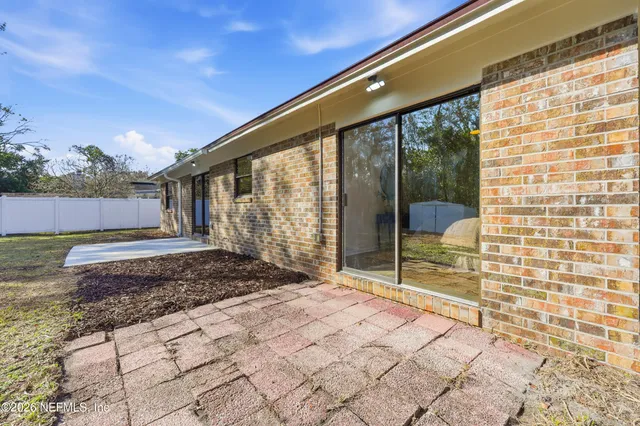 a house view with a backyard space