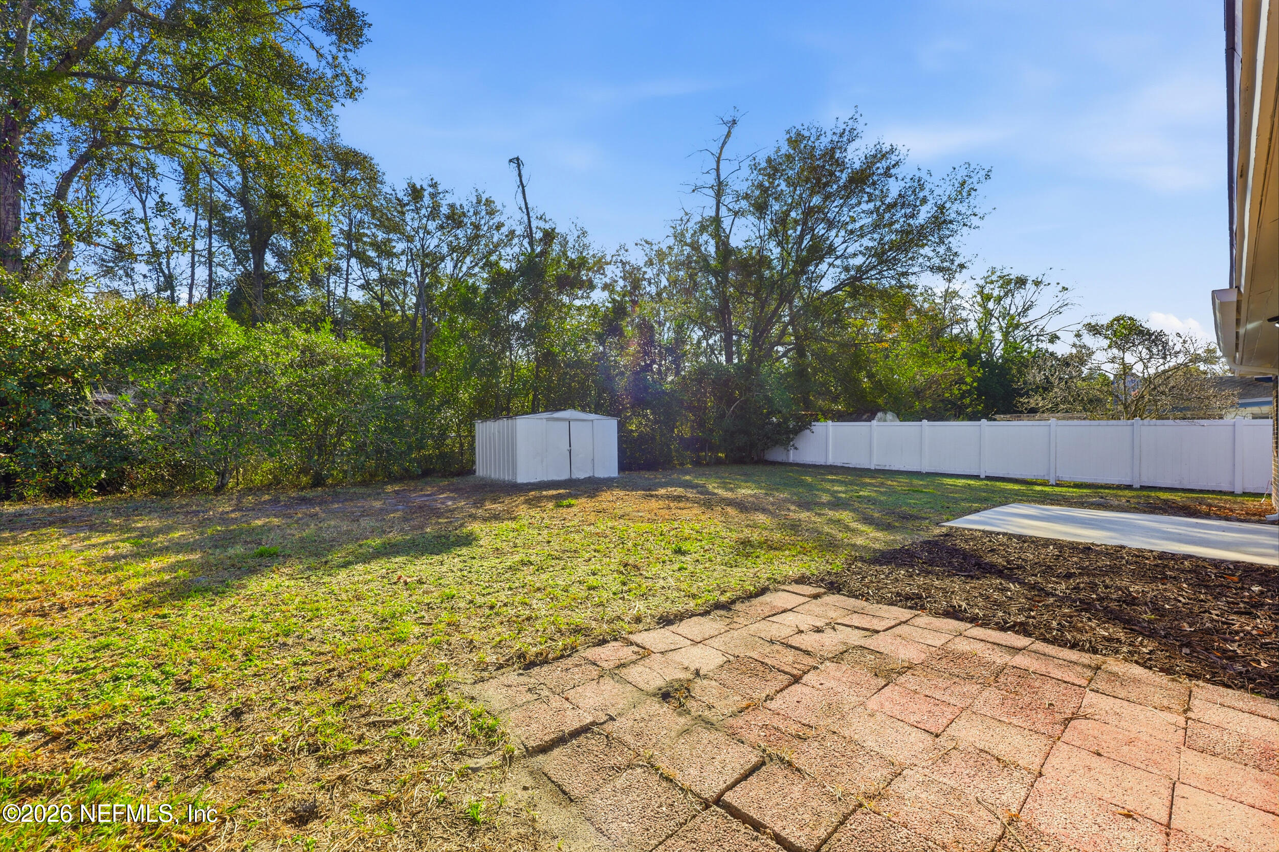 2171 Carter Braxton Road Orange Park, FL 32073 - Photo 16 of 39 a view of a yard with swimming pool