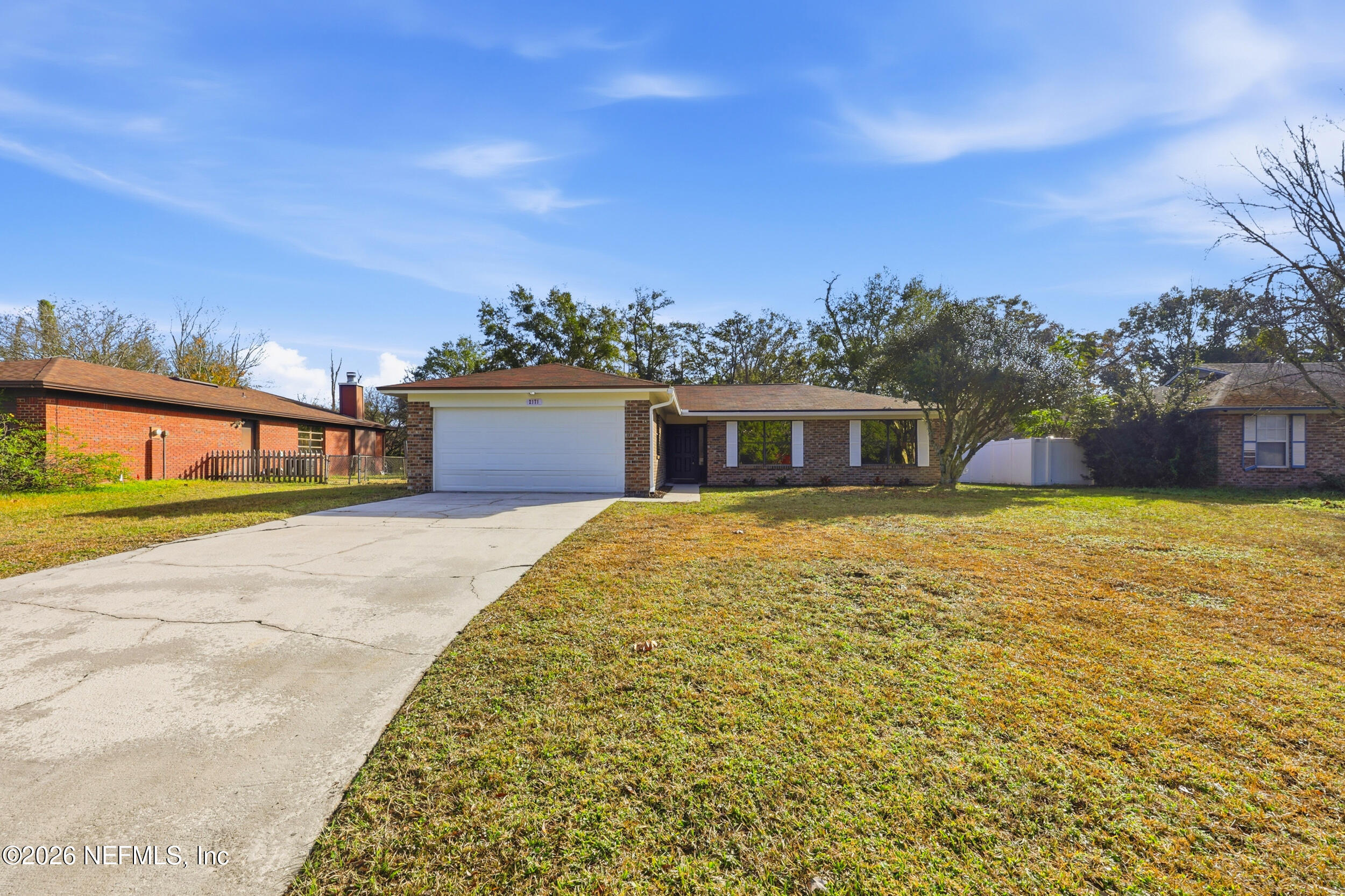 2171 Carter Braxton Road Orange Park, FL 32073 - Photo 18 of 39 a front view of a house with a yard
