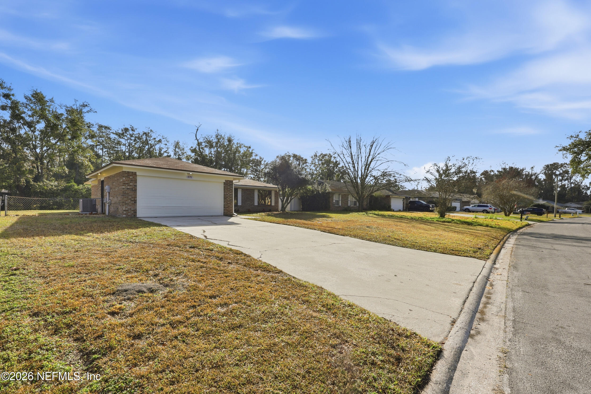 2171 Carter Braxton Road Orange Park, FL 32073 - Photo 23 of 39 a view of swimming pool with large trees and lawn chairs
