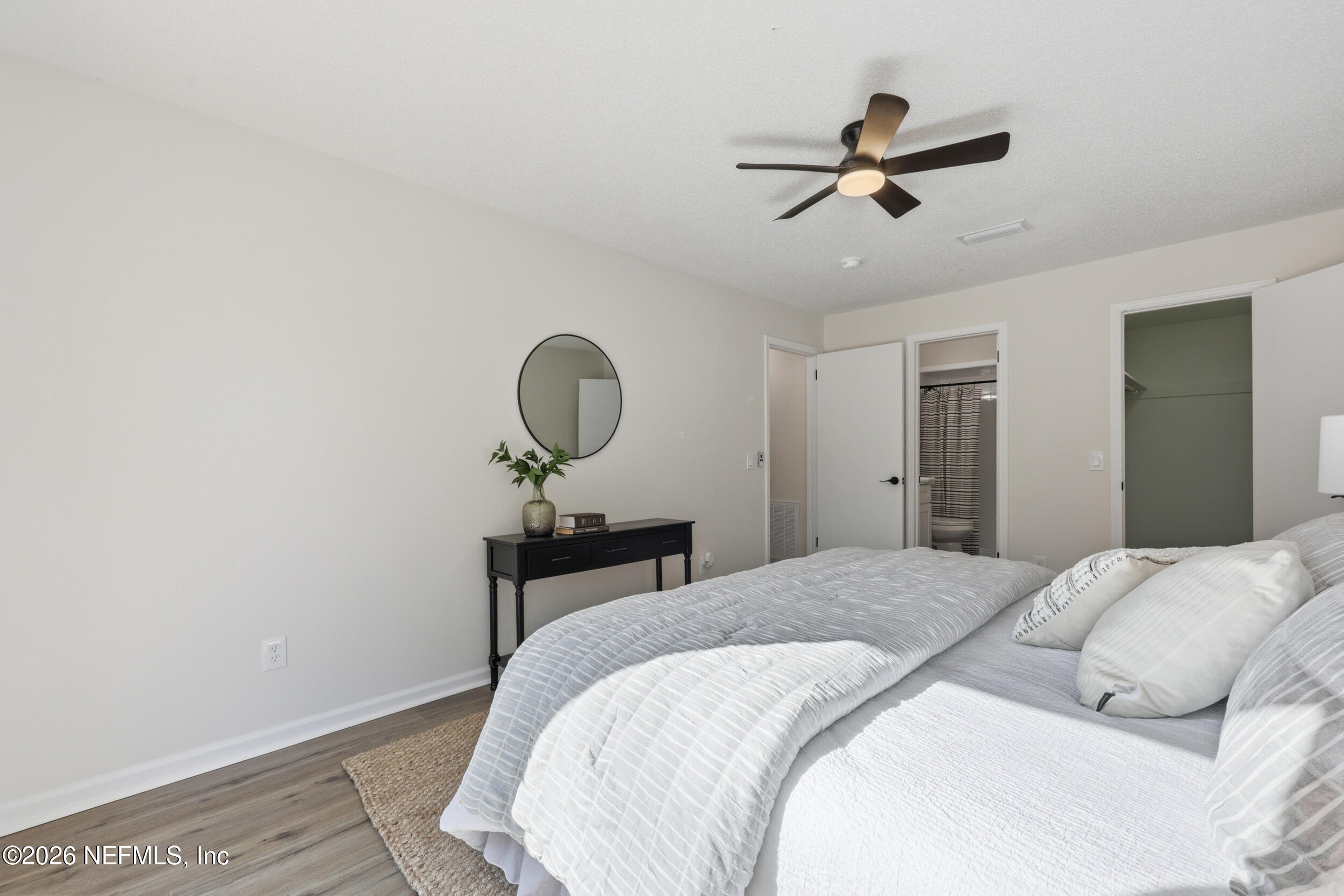 2171 Carter Braxton Road Orange Park, FL 32073 - Photo 6 of 39 a bedroom with a bed and a chandelier